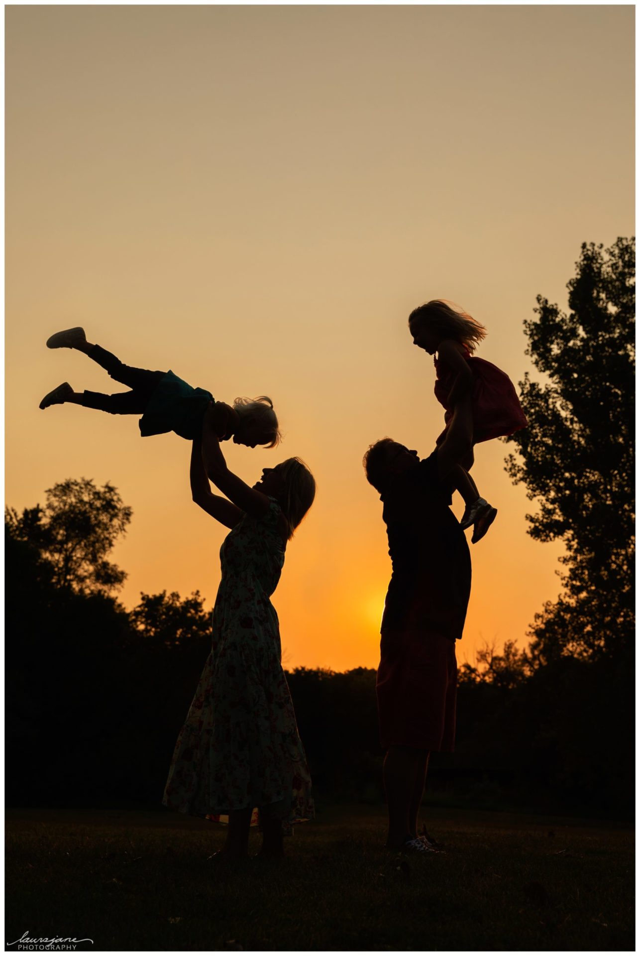 Amazing silhouette of family of four by Waukesha family photographer
