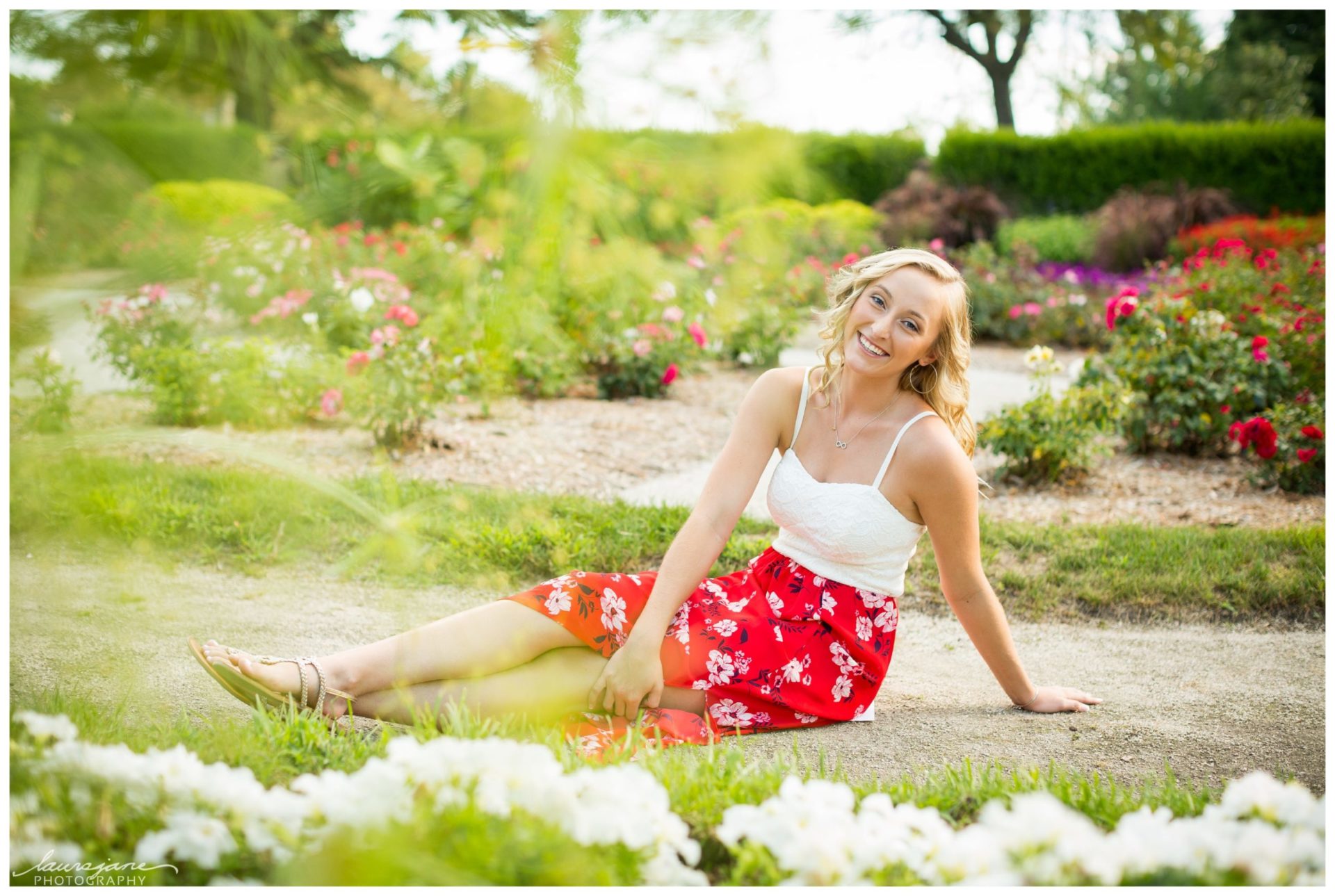 Senior portraits in flower gardens at Frame Park in Waukesha Area