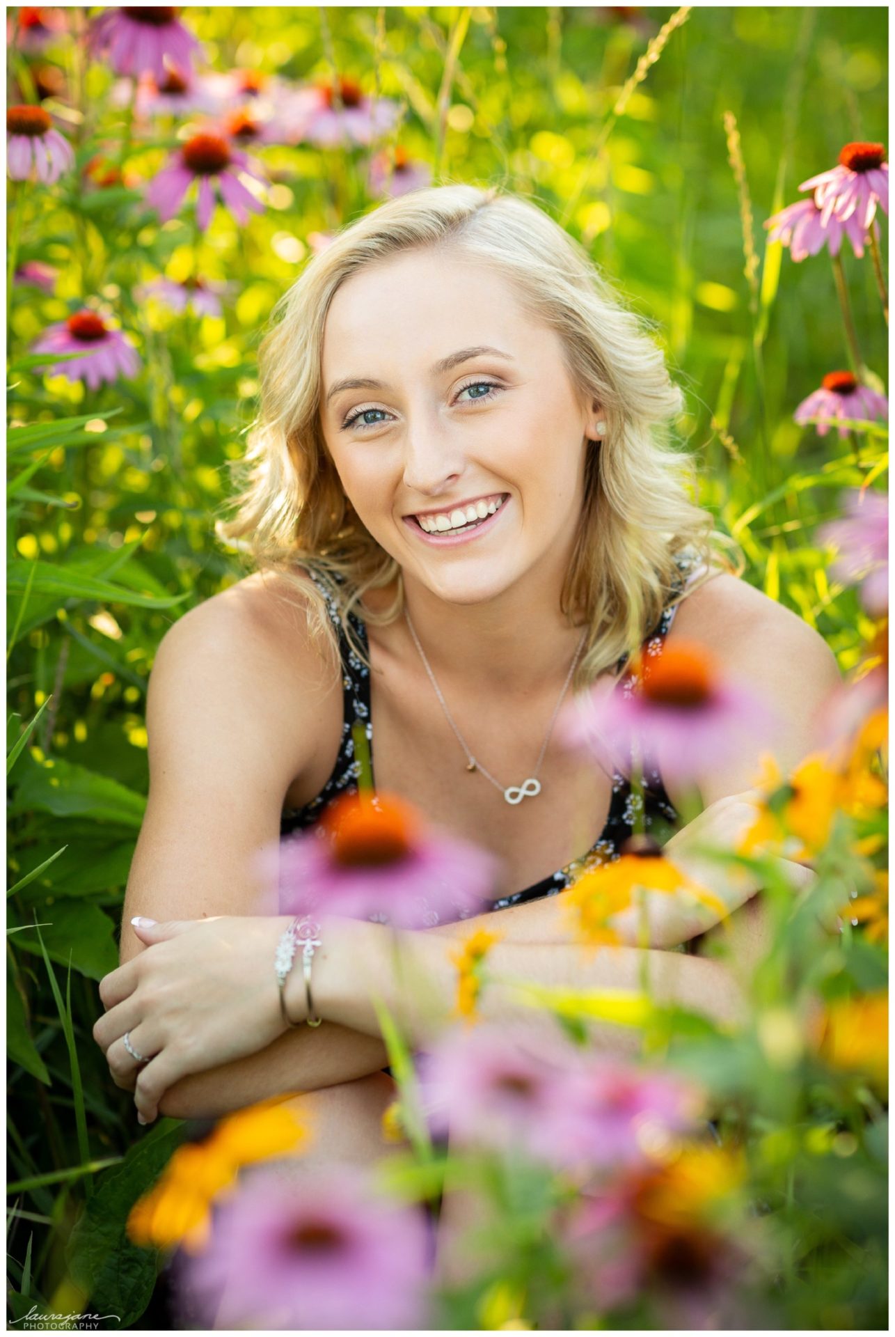 Senior portraits with flowers by LauraJane Photography