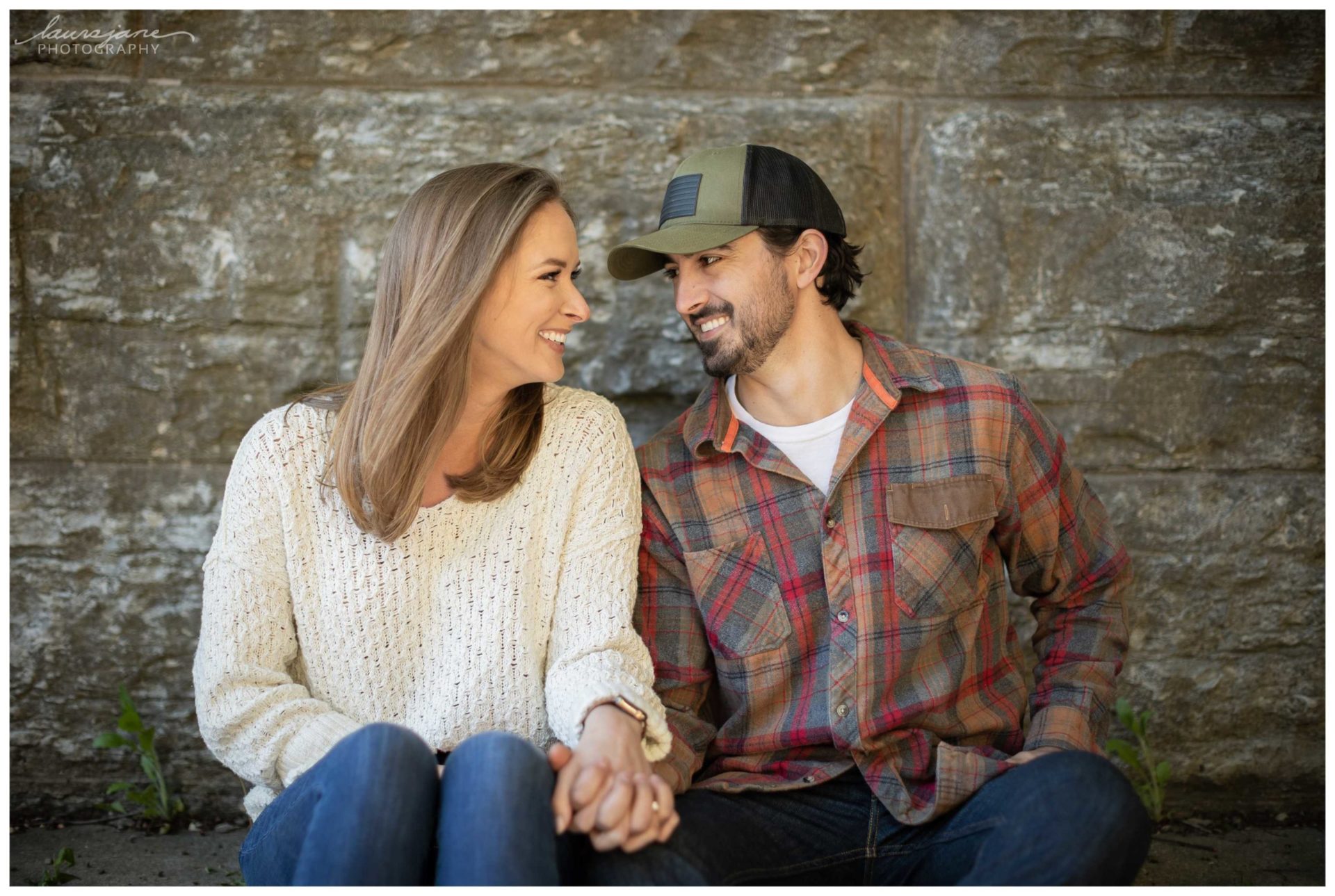 Milwaukee Couple Sitting Against Rocks